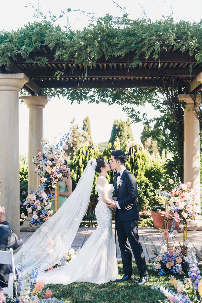 Couple at the ceremony arch